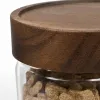Heart-shaped brown lecithin slimming and shaping tablets in a transparent glass jar with a wooden lid Application Scenario